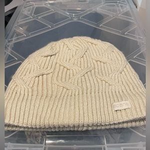 Cream colored Abana Sherpa lined knit cap